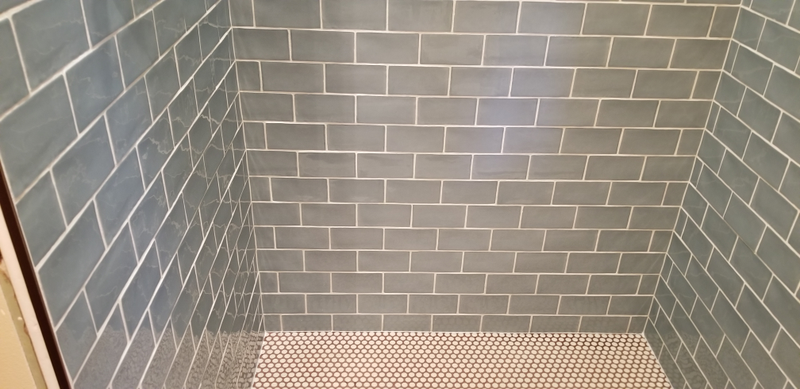 There’s one floor tile that’s slightly off in the picture, that was fixed! And this was taken before the caulking around the pan was completed too.